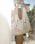 Hand-Beaded Underarm Triangle Bag (Bow) in light champagne