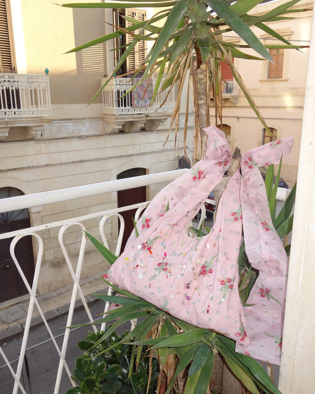 Silk rose beaded bag on balcony
