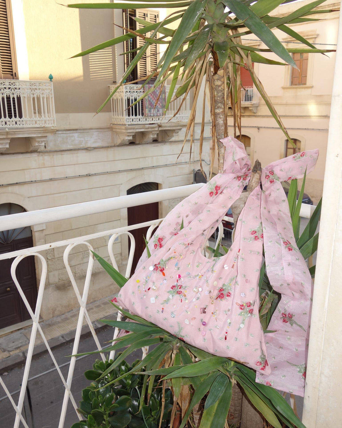 Silk rose beaded bag on balcony