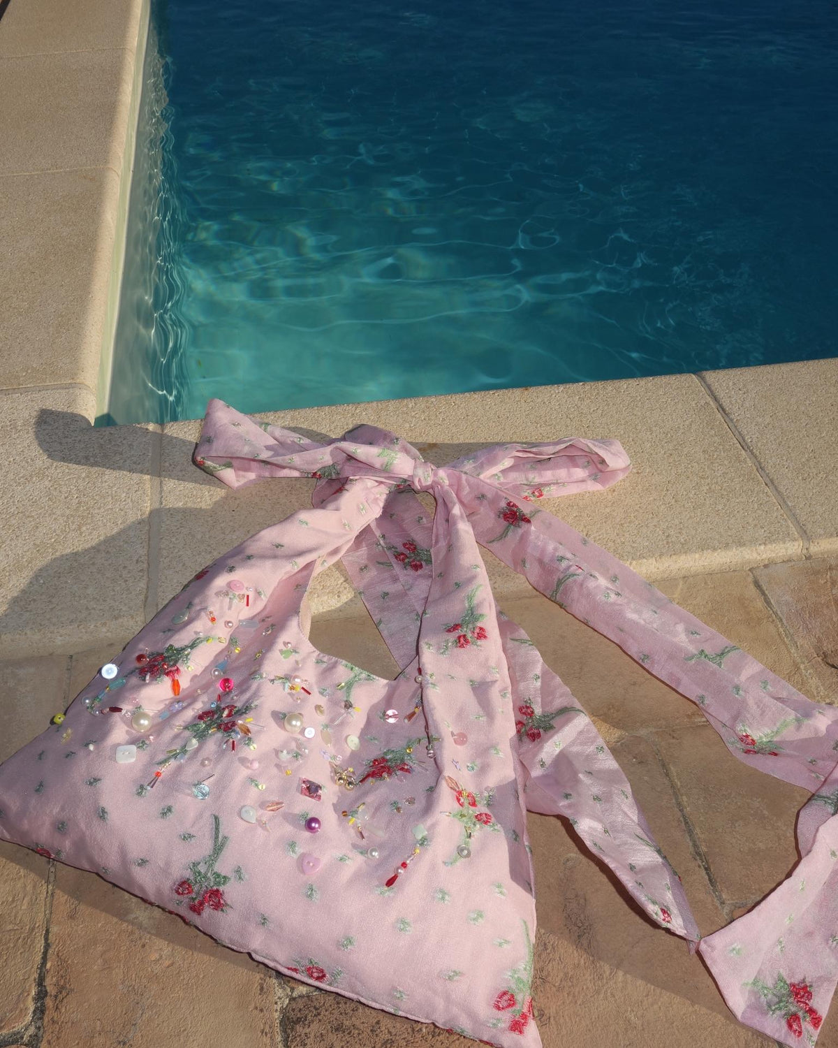 Silk rose beaded bag poolside
